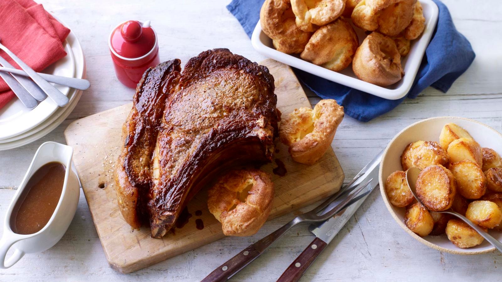 Roast rib of beef and bone marrow gravy with roast potatoes