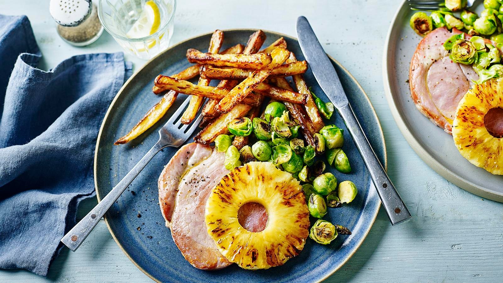 Gammon and chips with pineapple and greens